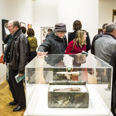 People looking at items in a museum.