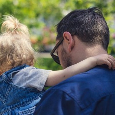 Man carrying daughter