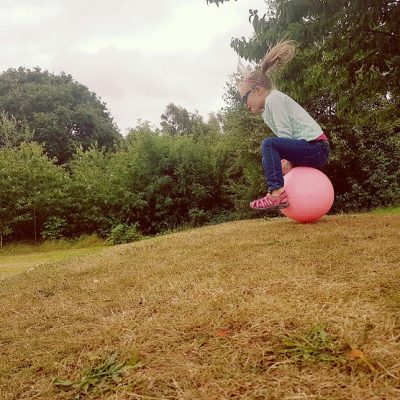 Young girl on space hopper