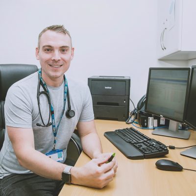 NHS worker at his desk