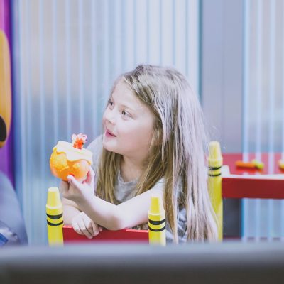 Young girl is holding a cake