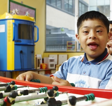 Young boy playing table football