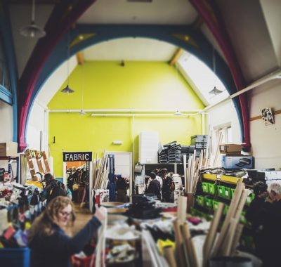 Lady looking in shop for fabrics