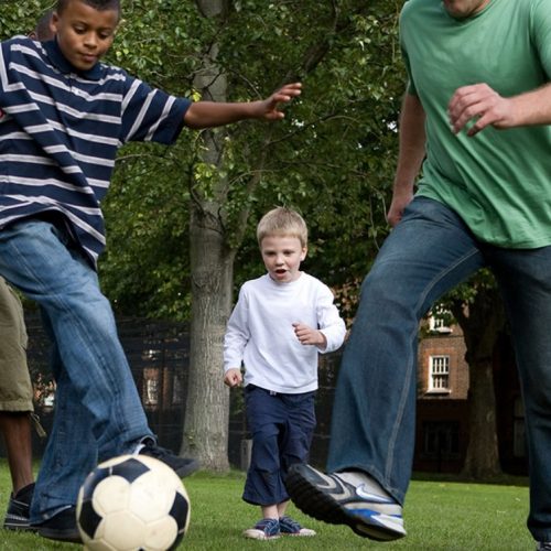 Young boys playing football