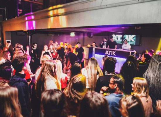 Group of people dancing in a club